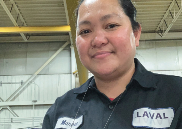 Marnie Bacharo, Moldmaking Apprentice - Shown wearing coveralls at work.