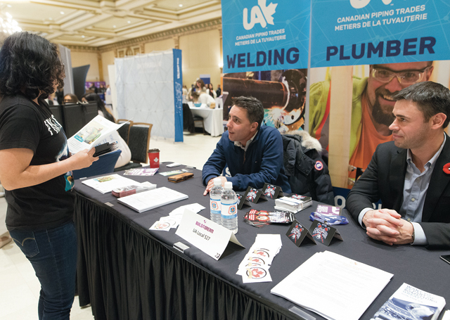 UA recruiters talk to a student at a Build a Dream career discovery expo in Ontario.